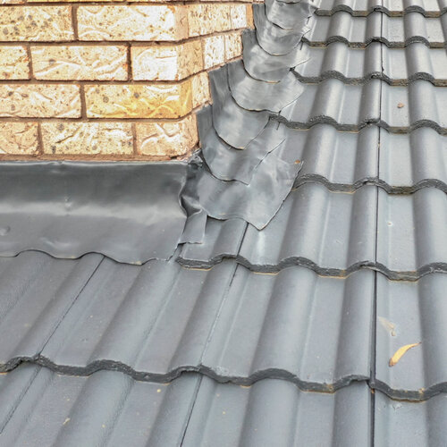 flashing on a gray tile roof